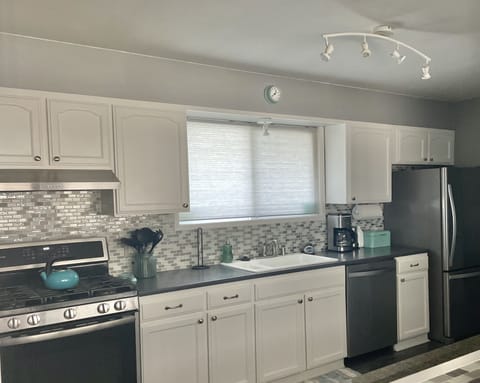 View of one side of the kitchen from great room and bar area