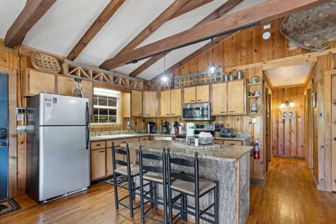 Well Equipped Kitchen with Island Bar Seating