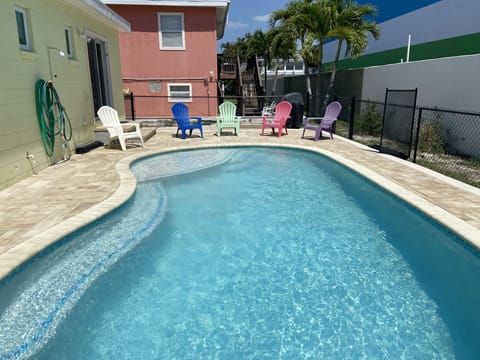Heated pool with sun shelf and extra long bench for seating