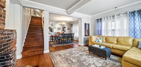 Relax in a cozy, sunlit living room with Smart TV and fast Wi-Fi