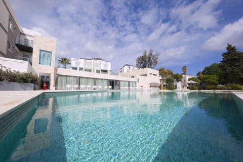 Indoor pool, 2 outdoor pools, open 8:00 AM to 8:00 PM, pool umbrellas