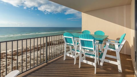 Enjoy meals or drinks at the outdoor patio table while taking in the beautiful views from your beachfront balcony