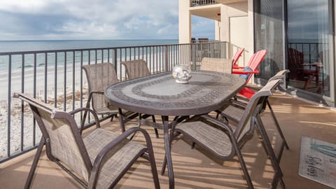 Dine al fresco at the spacious table, enjoying the fresh air and views while surrounded by comfortable seating