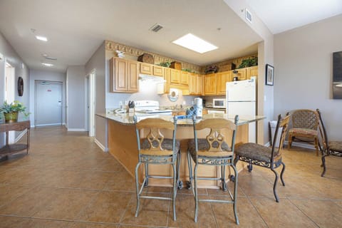 Gather around the kitchen, enjoying meals and conversation in this welcoming space with ample seating