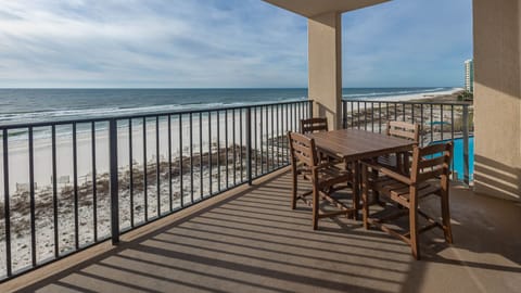 Dine al fresco at the outdoor table, enjoying refreshing breezes and views of the tranquil waters and shoreline