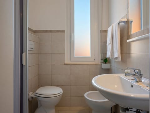 Family Quadruple Room, Balcony | Bathroom | Shower, free toiletries, bidet, towels