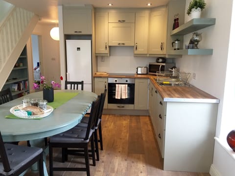 Kitchen and Dining room - cooker, dishwasher, microwave, toaster, kettle, more.