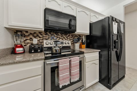 Fully stocked kitchen with Air Fryer, Blender. Coffee Bar is in the dining room!
