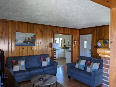 Living room includes couch, love seat, TV