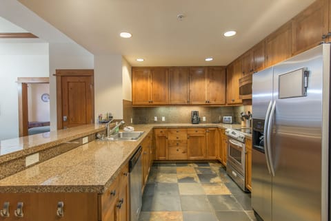 Kitchen open to living area. Granite counter, stainless steel appliances. Clean!