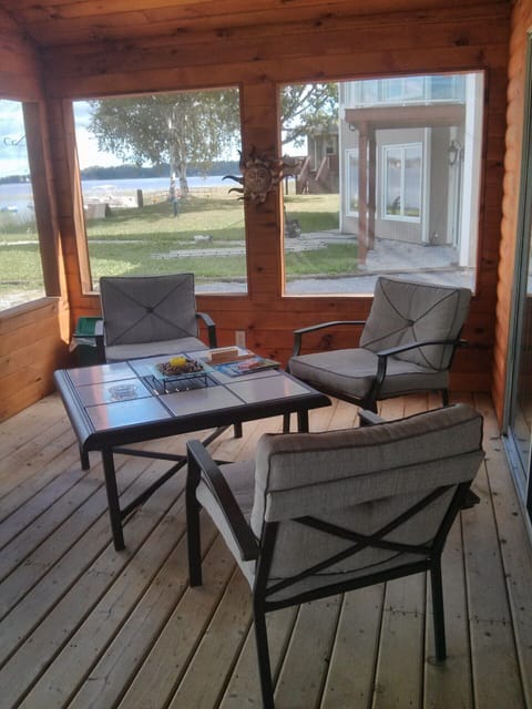 Seating area in enclosed front porch.