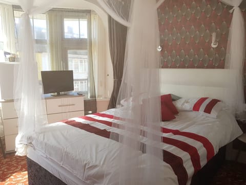 Family Double or Twin Room, Private Bathroom | Down comforters, individually decorated, individually furnished