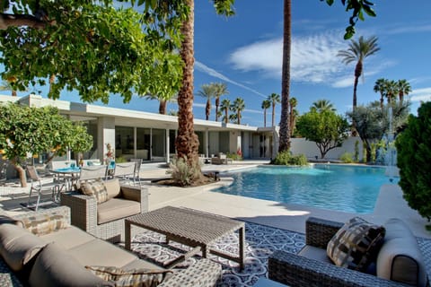 Large elegant pool, multiple seating areas, BBQ dining area - a personal resort