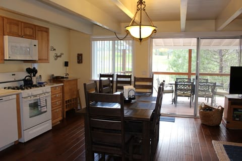 Dining table seats 8 when leaf is used & a view of deck with outdoor seating
