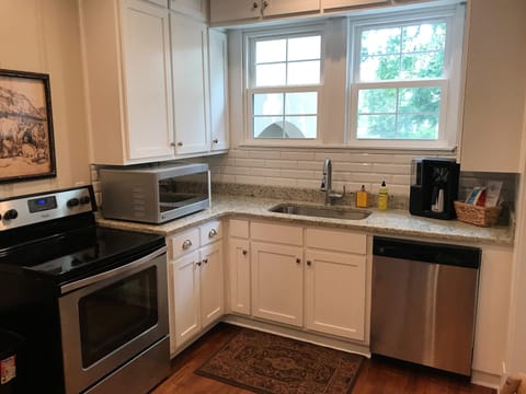 Modern kitchen with stainless appliances and granite countertops
