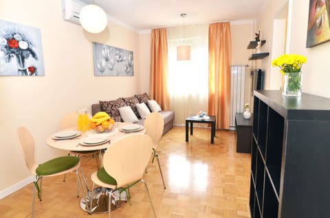 Apartment, City View | Living area | Flat-screen TV