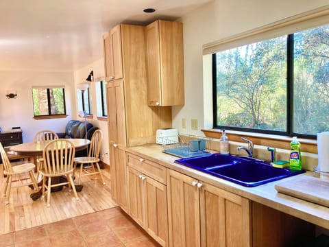 Cobalt blue farmhouse sink and hickory cabinets