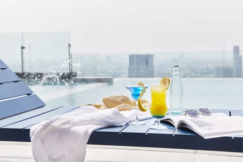 Outdoor pool, open 6 AM to 10 PM, sun loungers