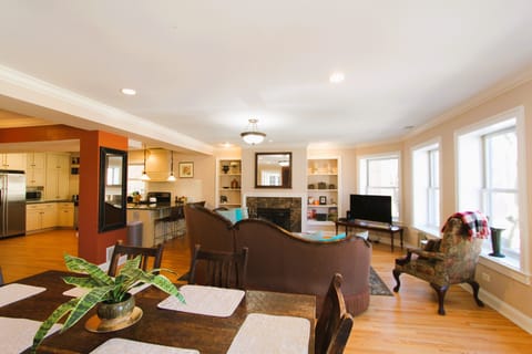 Spacious open concept with fireplace. This is our new sectional that seats 7.


