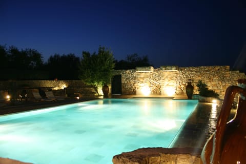 Outdoor pool, a waterfall pool, sun loungers