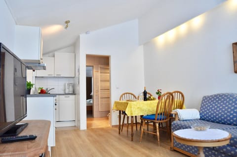 Deluxe Apartment, Terrace and Balcony | Living room | Flat-screen TV