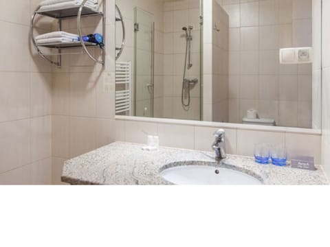 Shower, free toiletries, hair dryer, slippers