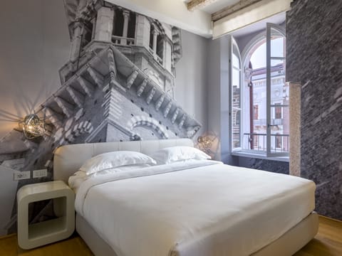 Premium bedding, down comforters, pillowtop beds, in-room safe