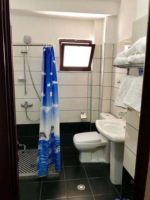 Shower, free toiletries, hair dryer, slippers