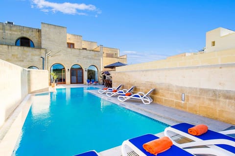 Pool area of Four Winds holiday villa in Malta