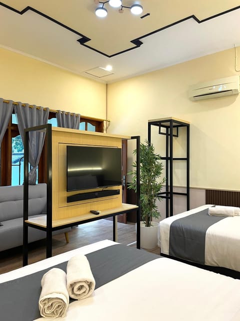 Suite, 2 Double Beds | Living area | LCD TV