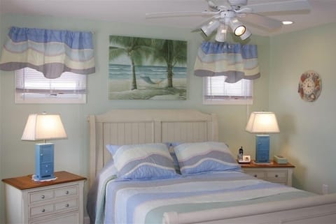 Private master suite with a balcony, comfortable sitting area, private bath