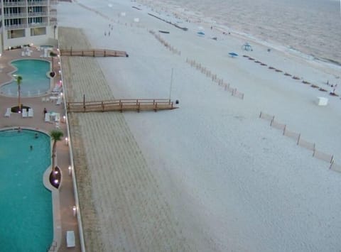 THE VIEW from the balcony at twilight - a jacuzzi is at the end of each pool
