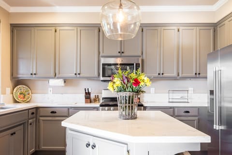 Updated & Fully Stocked Kitchen with Quartz Countertops &