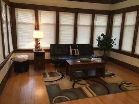 Beautiful Sun Room with Double Futon and Computer Friendly Coffee Table.