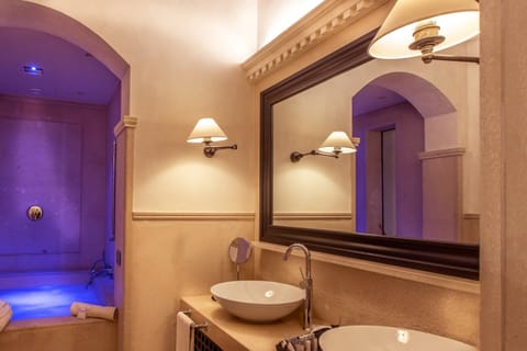 Combined shower/tub, designer toiletries, hair dryer, bathrobes