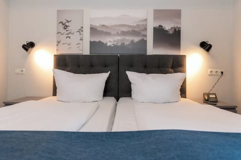 Standard Double Room | Minibar, in-room safe, desk, iron/ironing board