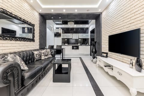 Luxury Apartment, 1 Bedroom (Lenina Street 11) | Living area | 42-inch flat-screen TV with cable channels, TV