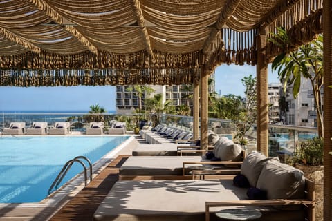 Outdoor pool, open 9:00 AM to 6:00 PM, pool umbrellas, sun loungers
