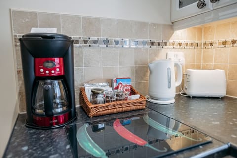 Luxury Apartment, 1 Bedroom | Private kitchen | Mini-fridge, microwave, stovetop, coffee/tea maker