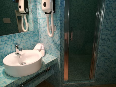 Shower, free toiletries, hair dryer, slippers