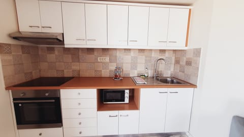 Apartment, 2 Bedrooms | Private kitchen | Mini-fridge, stovetop, electric kettle, toaster