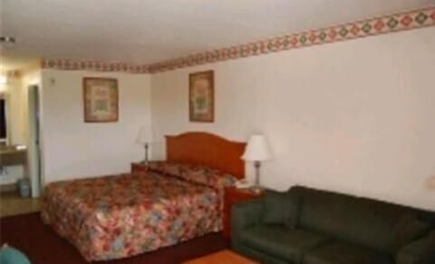 Desk, laptop workspace, blackout drapes, iron/ironing board