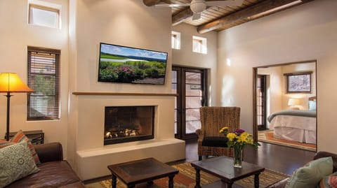 Living area with doors to patio and double pocket doors to first floor bedroom. 