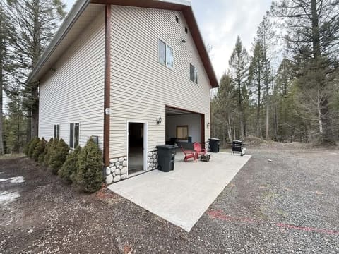 open garage with grill and firepit