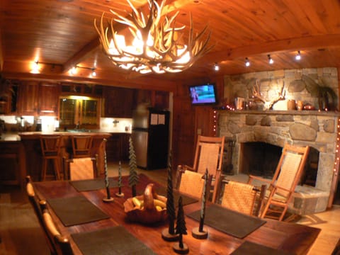 Keeping room with wood burning fireplace and HD TV