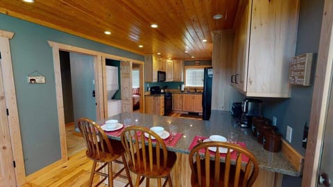 Additional seating is available at the kitchen island with 3 more seats.