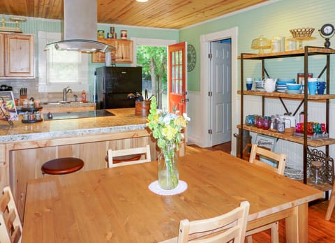 Kitchen has access to one bedroom and the back yard.