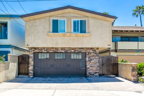 Driveway fits 3 cars plus 1 car in garage... ample parking! Privacy gates!