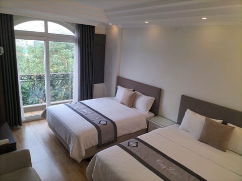 Family Quadruple Room, Non Smoking | Minibar, desk, soundproofing, iron/ironing board