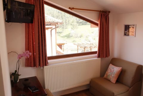 Double Room | Living area | Flat-screen TV